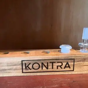 METTLE display rack shown on a wooden shelf