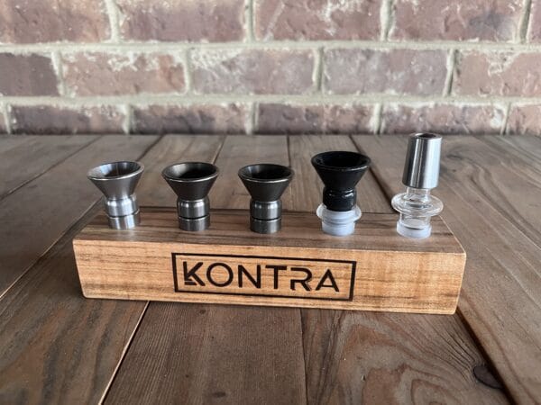 Assortment of bowls by Kontra held by wooden banger rack